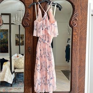 Shoshanna pleated pink floral dress with ruffle neckline detailing.